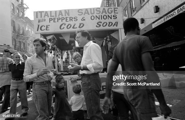 New York City - People stop and grab a bite to eat at a food cart during the annual Feast Of San Gennaro Festival in Little Italy.