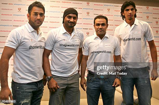 Dhoni, Harbhajan Singh, Virender Sehwag and Ishant Sharma during the launch of their personal websites in New Delhi on Monday, December 28, 2009.