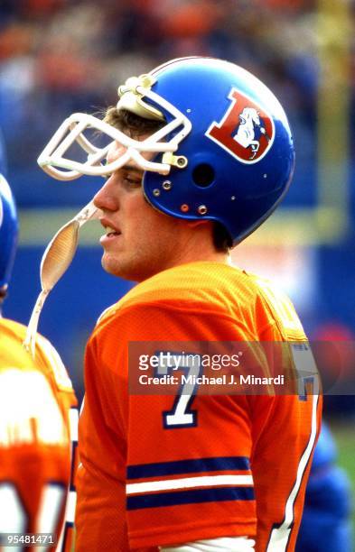 John Elway of the Denver Broncos looks out over the field in his first NFL game against the Seattle Seahawks at Denver Mile High stadium, Elway...