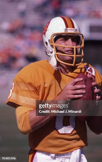 Quarterback Steve Young of the Tampa Bay Buccaneers warms up with the ball prior to a NFL game against the Minnesota Vikings at Tampa Stadium on...