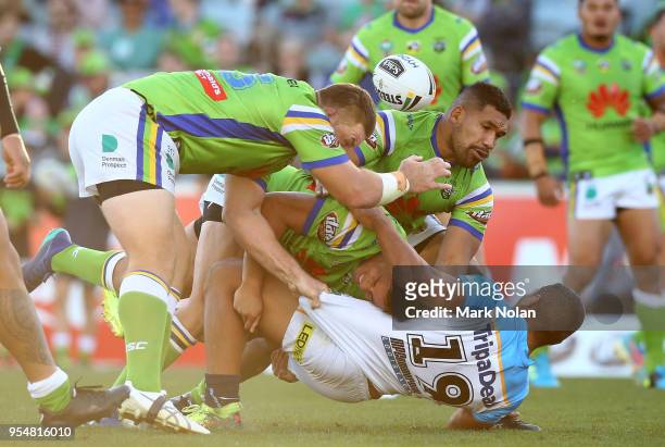 Moeaki Fotuaika of the Titans loses the ball in atackle during the round nine NRL match between the Canberra Raiders and the Gold Coast Titans at GIO...