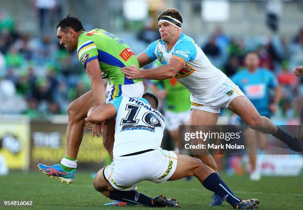 Jordan Rapana of the Raiders is tackled during the round nine NRL match between the Canberra Raiders and the Gold Coast Titans at GIO Stadium on May...