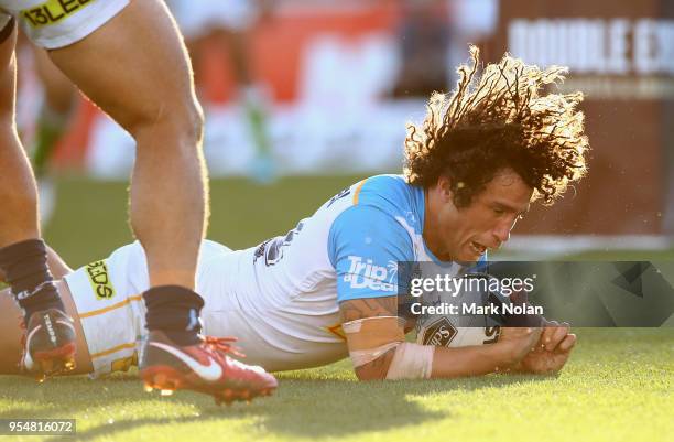 Kevin Proctor of the Titans scores a try during the round nine NRL match between the Canberra Raiders and the Gold Coast Titans at GIO Stadium on May...