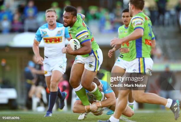 Dunamis Lui of the Raiders is tackled during the round nine NRL match between the Canberra Raiders and the Gold Coast Titans at GIO Stadium on May 5,...