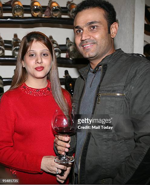 Host Virender Sehwag with wife Arti at a party in his honour, for his stupendous Test performance against Sri Lanka, at Smoke House Grill in Greater...