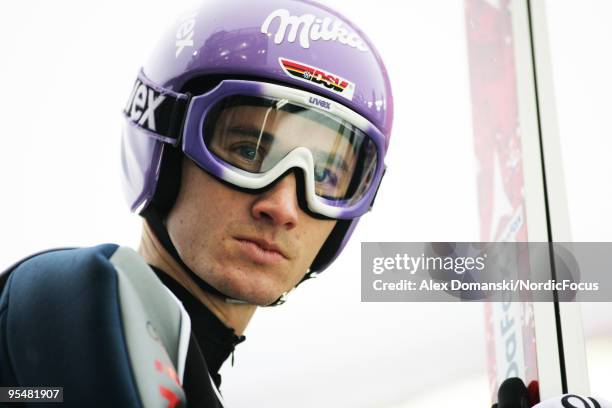 Martin Schmitt of Germany looks on during the FIS Ski Jumping World Cup event at the 58th Four Hills Ski Jumping Tournament on December 29, 2009 in...