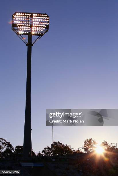 The sun sets over Canberra Stadium during the round nine NRL match between the Canberra Raiders and the Gold Coast Titans at GIO Stadium on May 5,...