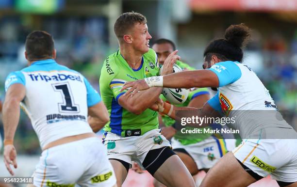 Jack Wighton of the Raiders is tackled during the round nine NRL match between the Canberra Raiders and the Gold Coast Titans at GIO Stadium on May...