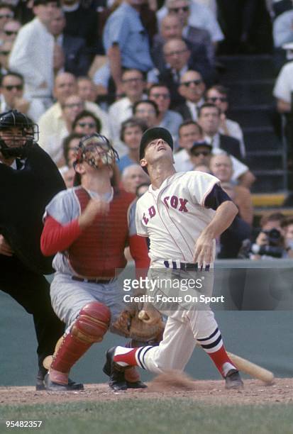 S: Outfielder Carl Yastrzemski of the Boston Red Sox swings and watches the flight of his ball during a MLB baseball game circa 1960's at Fenway Park...