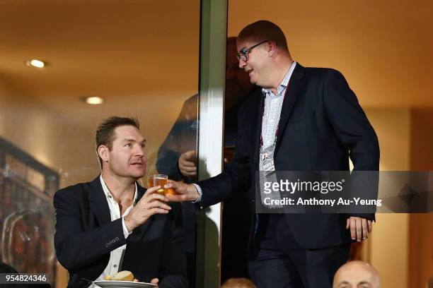 Warriors CEO Cameron George hands a drink to former All Black Ali Williams during the round nine NRL match between the New Zealand Warriors and the...