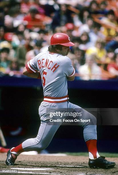 S: Catcher Johnny Bench of the Cincinnati Reds swings and watches the flight of his ball against the New York Mets during a MLB baseball game circa...