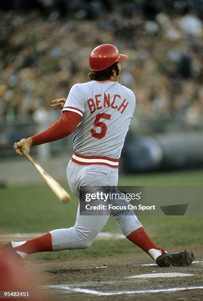 Catcher Johnny Bench of the Cincinnati Reds swings at a pitcht and watches the flight of his ball against the Oakland Athletics during the World...