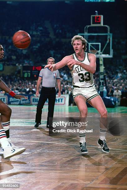 Larry Bird of the Boston Celtics passes during a game played in 1984 at the Boston Garden in Boston, Massachusetts. NOTE TO USER: User expressly...