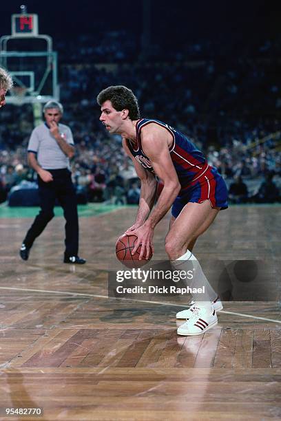 Kelly Tripucka of the Detroit Pistons looks to make a move against the Boston Celtics during a game played in 1984 at the Boston Garden in Boston,...