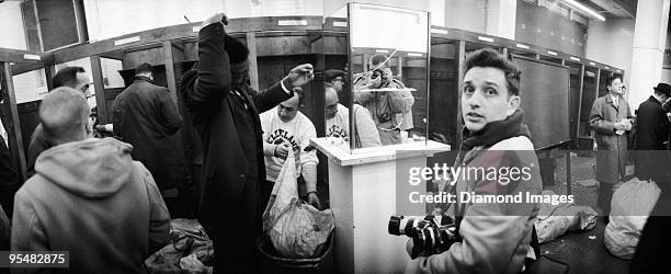 News photographer Ron Kuntz of United Press International looks back at photographer Frank Aleksandrowicz as he takes a panoramic picture of...