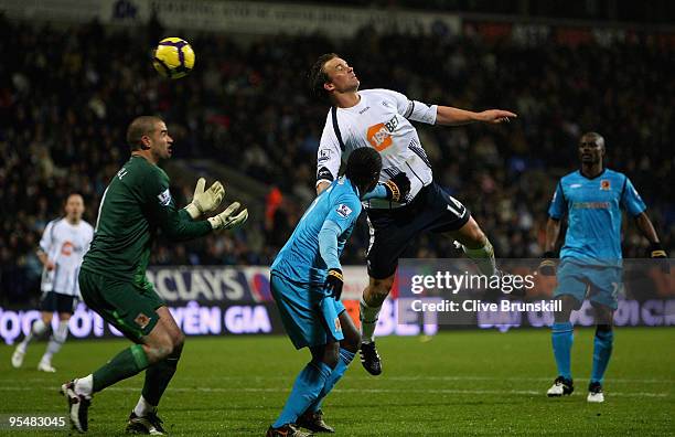 Kevin Davies of Bolton Wanderers heads the ball past goal keeper Boaz Myhill of Hull City to score the second goal during the Barclays Premier League...