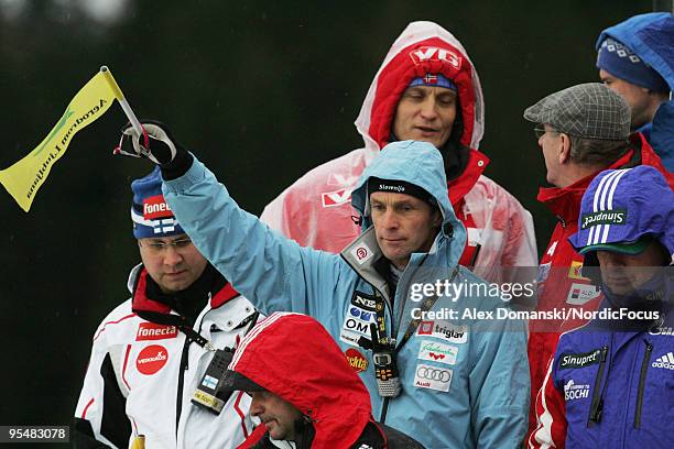 Matjaz Zupan head coach of Slovenia lifts the flag for the start during the FIS Ski Jumping World Cup event at the 58th Four Hills Ski Jumping...