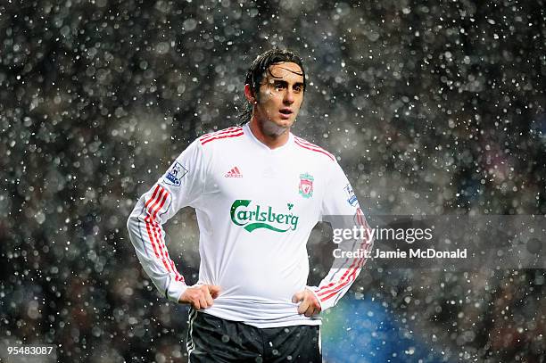 Alberto Aquilani of Liverpool looks on in the snow during the Barclays Premier League match between Aston Villa and Liverpool at Villa Park on...