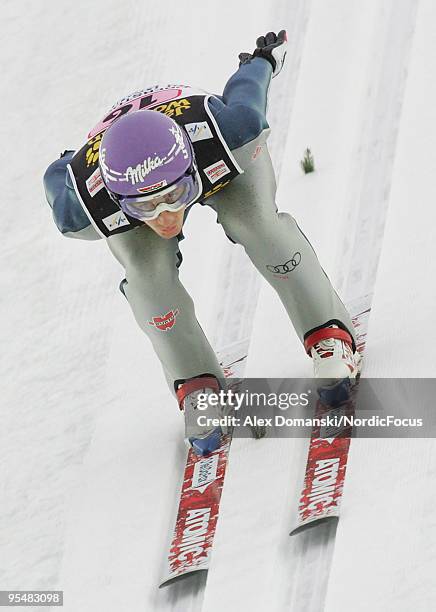 Martin Schmitt of Germany competes during the FIS Ski Jumping World Cup event at the 58th Four Hills Ski Jumping Tournament on December 29, 2009 in...