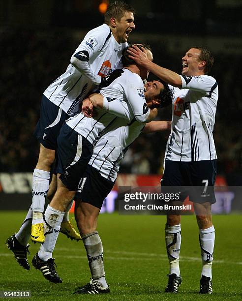 Kevin Davies of Bolton Wanderers is congratulated and lifted in the air by Tamir Cohen after scoring the second goal during the Barclays Premier...