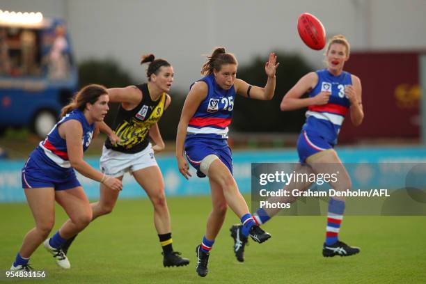 Rachel Gastin of the Western Bulldogs kicks during the round one AFLW match between the Western Bulldogs and Richmond at Whitten Oval on May 5, 2018...