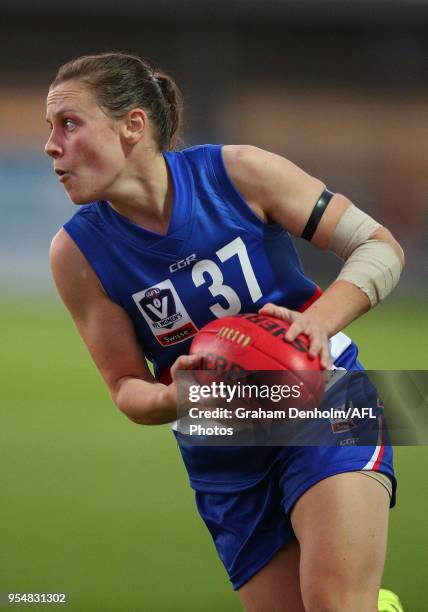 Lauren Murphy of the Western Bulldogs runs with the ball during the round one AFLW match between the Western Bulldogs and Richmond at Whitten Oval on...