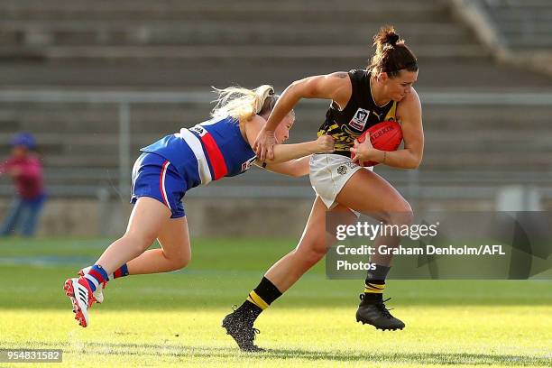 Jenna Colwell of Richmond is tackled during the round one AFLW match between the Western Bulldogs and Richmond at Whitten Oval on May 5, 2018 in...