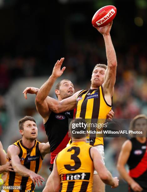 Ben McEvoy of the Hawks and Tom Bellchambers of the Bombers compete for the ball during the 2018 AFL round seven match between the Essendon Bombers...