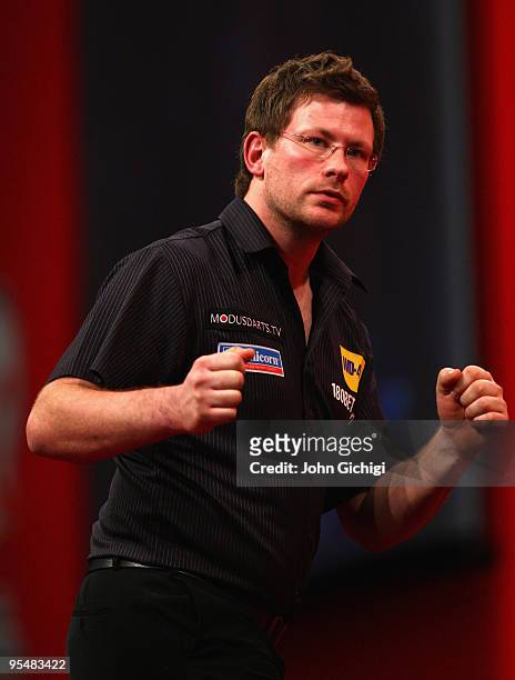James Wade of England in action against Michael Van Gerwen of Netherlands during the 2010 Ladbrokes.com World Darts Championships at Alexandra Palace...