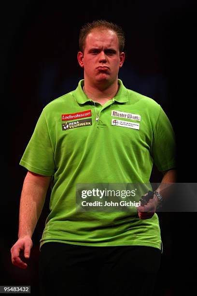 Michael Van Gerwen of Netherlands in action against James Wade during the 2010 Ladbrokes.com World Darts Championships at Alexandra Palace on...