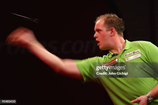 Michael Van Gerwen of Netherlands in action against James Wade during the 2010 Ladbrokes.com World Darts Championships at Alexandra Palace on...
