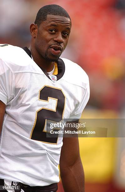 Aaron Brooks of the New Orleans looks on before a NFL football game against the Washington Redskins on October 13, 2002 at FedEx Field in Landover,...