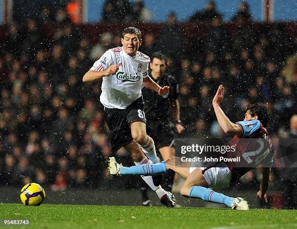 Steven Gerrard of Liverpool Carlos Cuellar Aston Villa during the Barclays Premier League match between Aston Villa and Liverpool at Villa Park on...