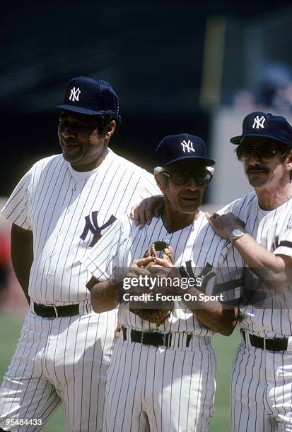 S: Billy Martin Manager of the New York Yankees standing with ex teammates Phil Rizzuto and Elston Howard before an Old timers game circa 1980's at...