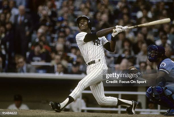 S: Second baseman Willie Randolph of the New York Yankees watches the flight of his ball as he follows through on a swing against the Kansas City...