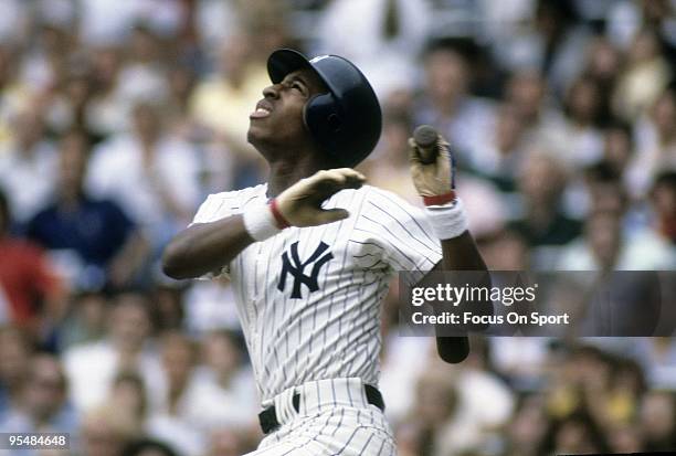 S: Second baseman Willie Randolph of the New York Yankees watches the flight of his ball as he follows through on a swing during a circa 1980's Major...