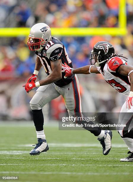 Randy Moss of the New England Patriots runs off the line of scrimmage with the ball against the Atlanta Falcons on September 27, 2009 at Gillette...