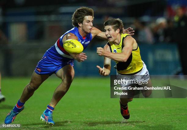 Liam Baker of Richmond handballs during the round five VFL match between Footscray and Richmond at Whitten Oval on May 5, 2018 in Melbourne,...
