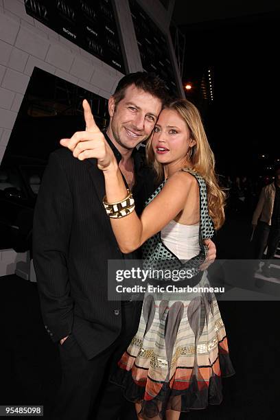 Gavin Keilly and Estella Warren at Columbia Pictures Premiere of "2012" at Regal Cinemas LA Live on November 03, 2009 in Los Angeles, California.