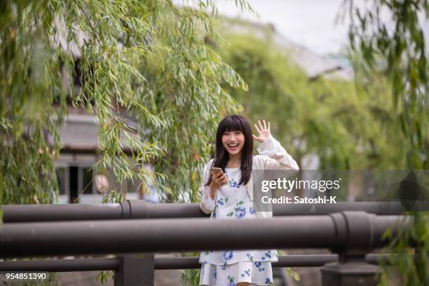 young woman just met boyfriend - willow tree stock pictures, royalty-free photos & images