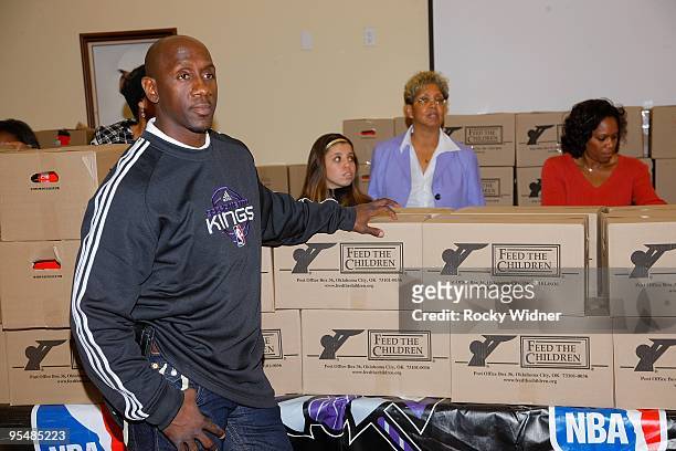 Bobby Jackson, formerly of the Sacramento Kings, helps feed 400 children and families at the Sacramento Urban League on December 22, 2009 in...