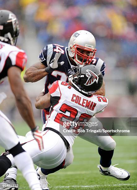 Sammy Morris of the New England Patriots is blocked by Erik Coleman during the game on September 27, 2009 at Gillette Stadium in Foxboro,...