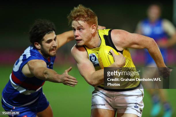 Blake Grewar of Richmond runs with the ball during the round five VFL match between Footscray and Richmond at Whitten Oval on May 5, 2018 in...