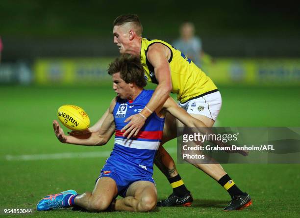 Nathan Mullenger-Mchugh of Footscray catches the ball under pressure during the round five VFL match between Footscray and Richmond at Whitten Oval...