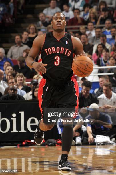 Marcus Banks of the Toronto Raptors moves the ball up court during the game against the Orlando Magic at Amway Arena on December 16, 2009 in Orlando,...