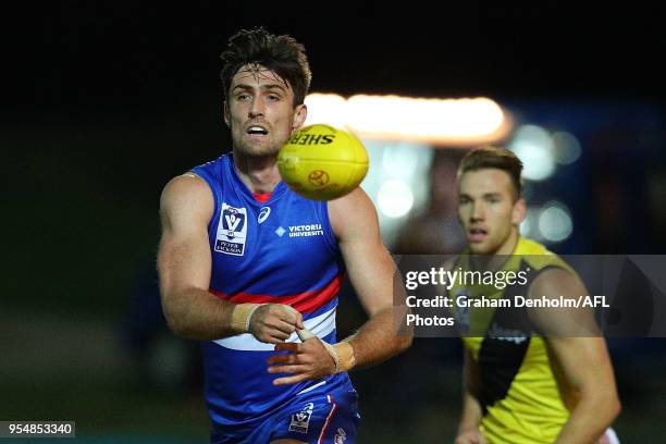 Thomas Campbell of Footscray handballs during the round five AFL match between Footscray and Richmond at Whitten Oval on May 5, 2018 in Melbourne,...