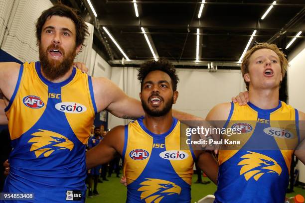 Josh Kennedy, Willie Rioli and Jackson Nelson of the Eagles sing the club song after winning the round seven AFL match between the West Coast Eagles...