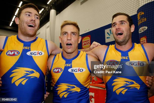 Jeremy McGovern, Brad Sheppard and Jack Darling of the Eagles sing the club song after winning the round seven AFL match between the West Coast...