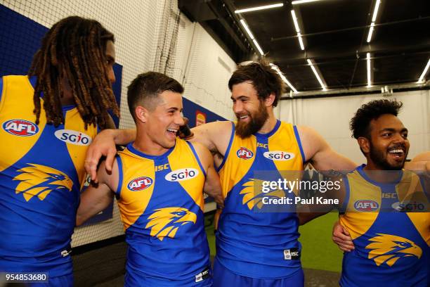 Nic Naitanui, Liam Duggan, Josh Kennedy and Willie Rioli of the Eagles sing the club song after winning the round seven AFL match between the West...