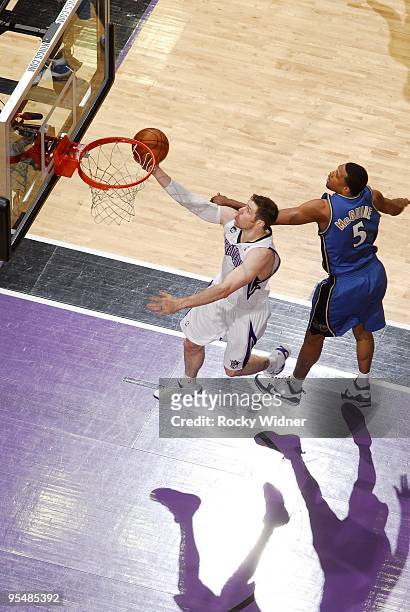 Andres Nocioni of the Sacramento Kings shoots a layup against Dominic McGuire of the Washington Wizards during the game at Arco Arena on December 16,...